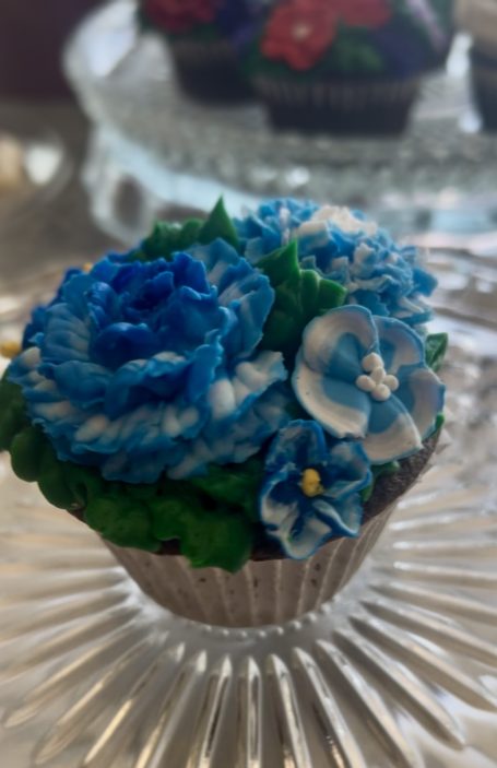 Got the Blues Cupcake is adorned with a mix of blue flowers.  Giving this cupcake to someone who is blue will result in happiness.
