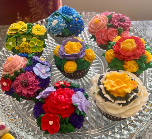 Flower Garden Cupcakes are decorated with a mix of flowers and colors.  Can be customized to your favorite colors, flowers, and flavors.